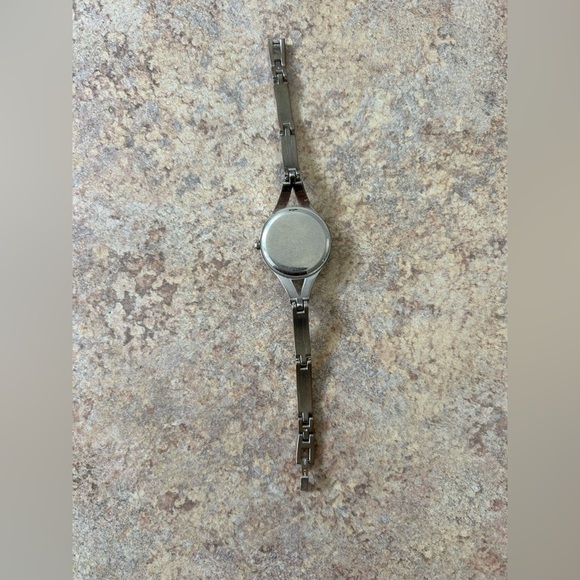 5/$25 Laura Scott silver bangle like watch. Cute and easy to wear. Pre-owned - Picture 5 of 6
